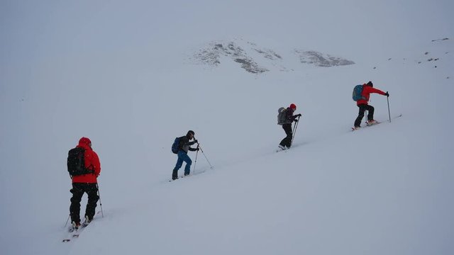 Men go skitour in deep snow