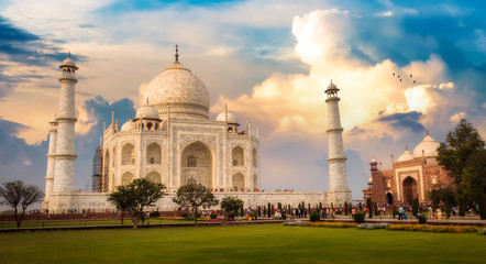 Fototapeta na wymiar Taj Mahal Agra India historical monument at sunrise with moody sky.