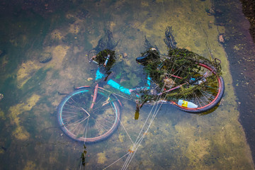 Old bike dumped in river 