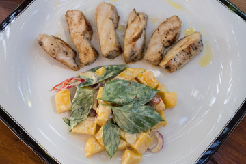 Mango salad with grilled chicken.