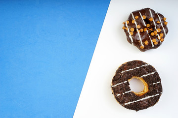 Assorted donuts served on a pastel background