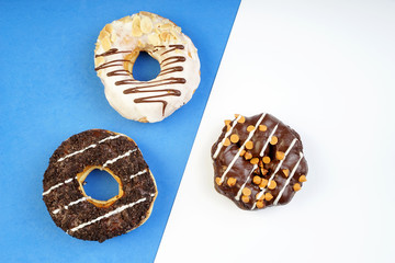 Assorted donuts served on a pastel background