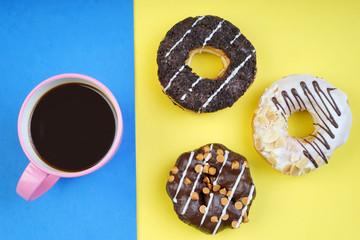 Assorted donuts served on a pastel background