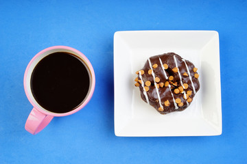 Assorted donuts served on a pastel background