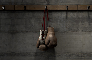 Worn Vintage Boxing Gloves Hanging In Change Room