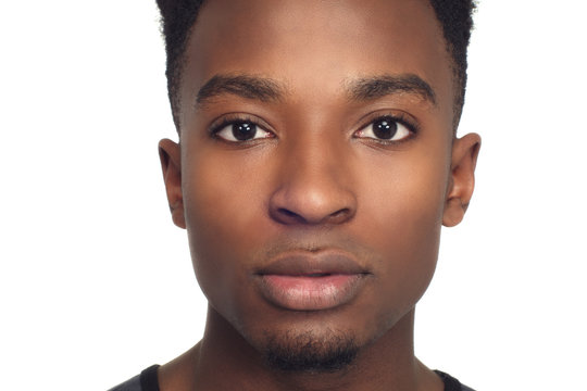 young man face closeup studio white background african man around twenty