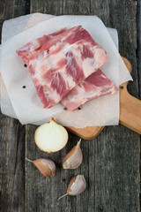 fresh pork ribs on a cutting Board, wooden background