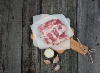 fresh pork ribs on a cutting Board, wooden background