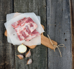 fresh pork ribs on a cutting Board, wooden background