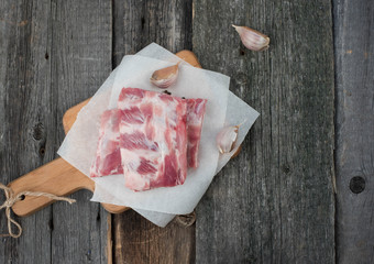 fresh pork ribs on a cutting Board, wooden background