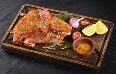 Raw fresh spare lamb ribs on board