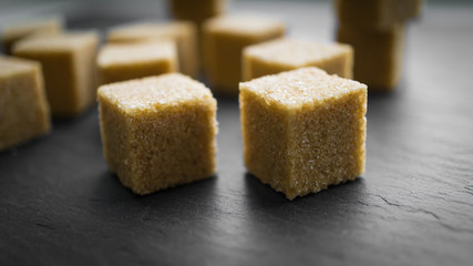 sugar cubes on a dark background. close up view