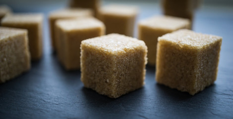 sugar cubes on a dark background. close up view