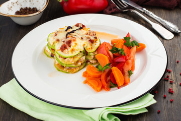 Vegetable lasagna and stewed veggies on a plate