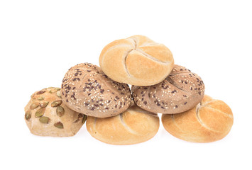 Kaiser roll, brown bun and bun with pumpkin seeds isolated on white background.