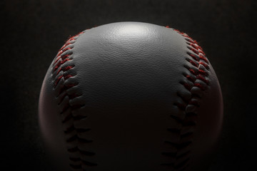 Baseball on black background.