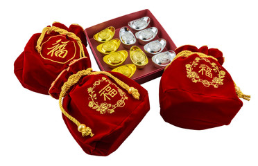 Decoration of chinese gold ingots in red box isolated on white background