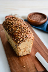 Homemade multi-grain bread on a wooden board.