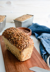 Homemade multi-grain bread on a wooden board.