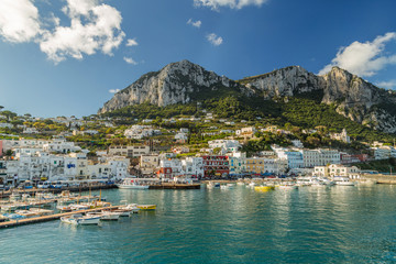 Beautiful landscape of Capri Island, Italy on a sunny day. View on the bay and Marina Grande harbor