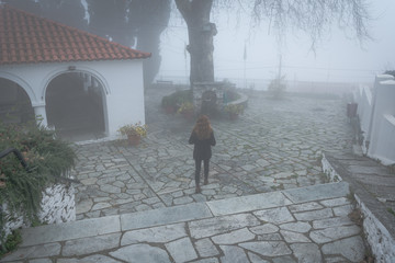 Woman Walking in Quaint Village in Portaria, Greece