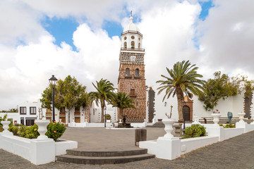 Fototapeta na wymiar Centre of Teguise, a small village on Lanzarote, Canary islands, Spain. The main square and Church Nuestra Senora de Guadalupe. Popular tourist destination and attraction