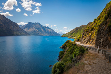 Fototapeta premium Scenic winding road along the shore at Lake Wakatipu, New Zealand, South Island