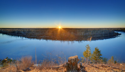 Fototapeta premium Evening landscape with a river, at sunset. Photographed in the central part of Russia.