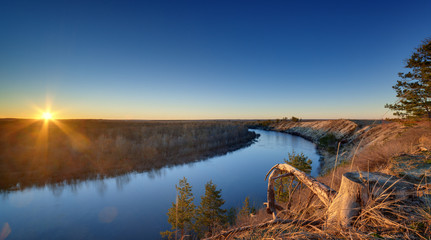 Evening landscape with a river, at sunset. Photographed in the central part of Russia.