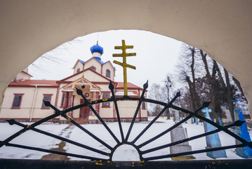 Cross on a gate of St James the Less Apostle wooden Orthodox church in Losinka, small village in Podlasie region of Poland