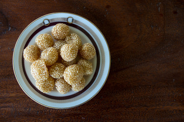 Onde onde goreng pastry snack in Indonesia on plate with copy space right.