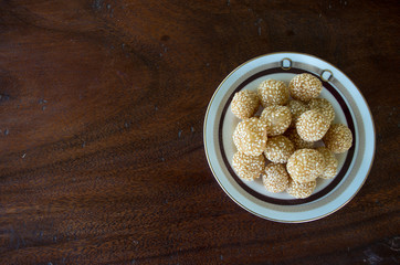 Onde onde goreng pastry snack in Indonesia on plate with copy space left.