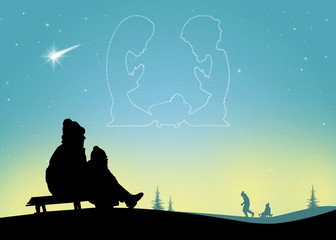 child on the sled looks at the nativity scene in the sky