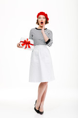 Young surprised lady holding gift surprise box.