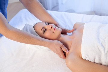 Obraz na płótnie Canvas doctor cosmetologist doing facial massage girl spa treatments