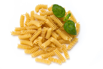 Uncooked fusilli pasta isolated white background.