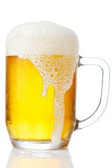 cold mug of beer with foam isolated on white background