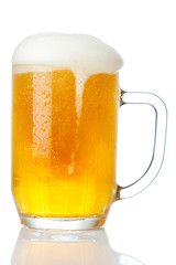 cold mug of beer with foam isolated on white background