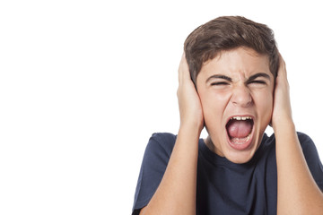 frustated boy shouting and covering his ears