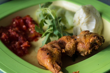 LALAPAN AYAM - typical Indonesian dish close-up.