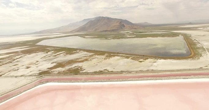 Drone shot of scenic Bonneville Salt Flats against mountains