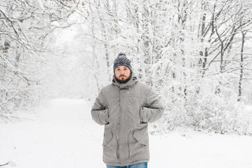 Fototapeta na wymiar a man in a snowy forest