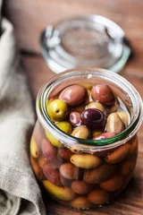 Keuken spatwand met foto taggiasche olives in a jar © anna.q