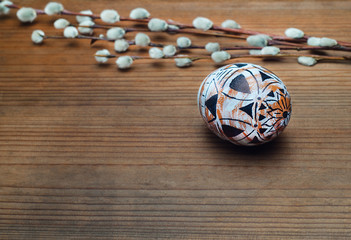 Colored egg on wooden background. Easter, Spring holidays