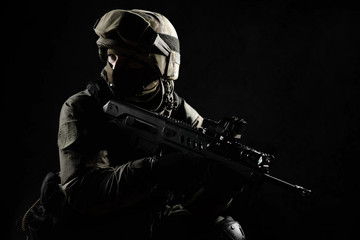 The man in the image of a member of the SWAT police with weapons