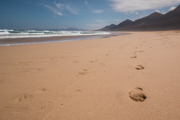 Fototapeta na wymiar Footprints on the sand. Cofete beach, Fuerteventura, Canary Islands, Spain.