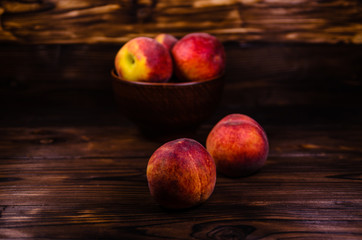 Fresh ripe peaches on wooden table