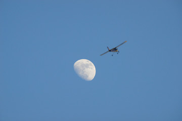 Almagro, Spain - January 27, 2018: Model airplane flying over the moon.