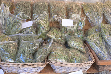 Herbs of the mountain from Greece packed in the shelf of the shop (oregano, chamomile, tea)