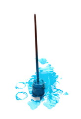 Spilled blue watercolor with bottle and paintbrush isolated on white background